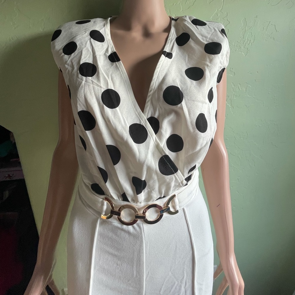 Color white with a few stains. Original price has been reduced. Size small